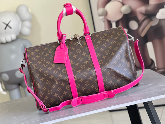 Keepall Bandoulière 50 – Monogram Canvas with Pink Leather Trim