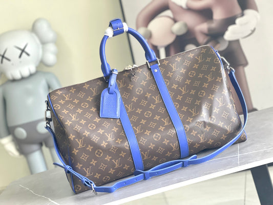 Keepall Bandoulière 50 – Monogram Canvas with Blue Leather Trim