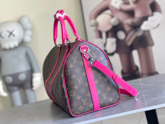 Keepall Bandoulière 50 – Monogram Canvas with Pink Leather Trim
