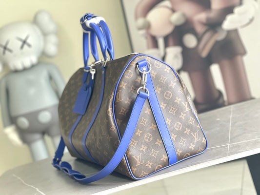 Keepall Bandoulière 50 – Monogram Canvas with Blue Leather Trim
