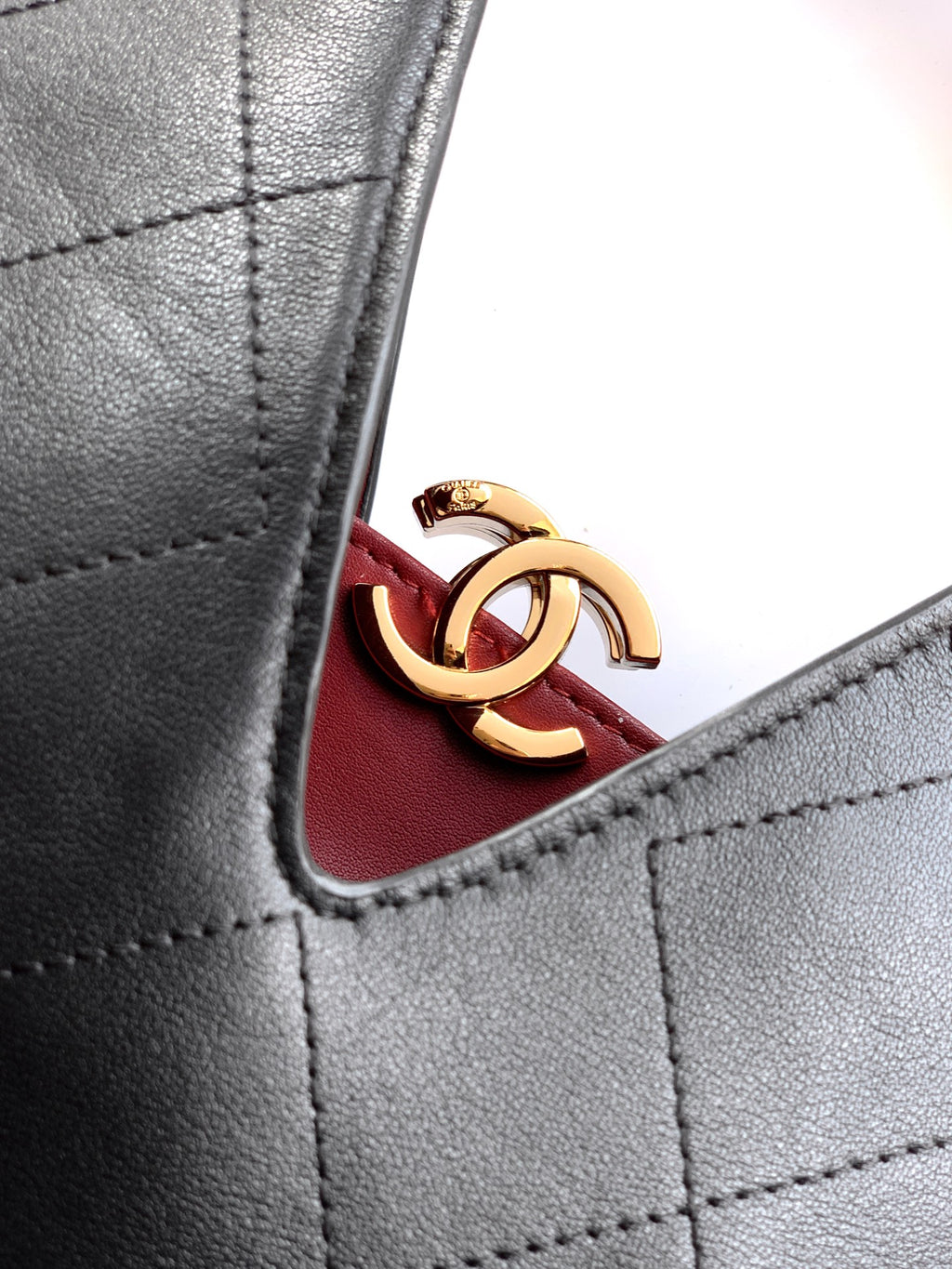 Quilted Leather Triangle Top Handle Bag