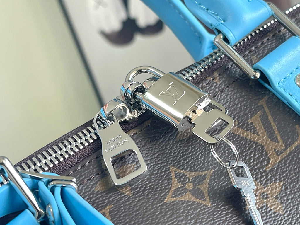 Keepall Bandoulière 50 – Monogram Canvas with Sky Blue Leather Trim