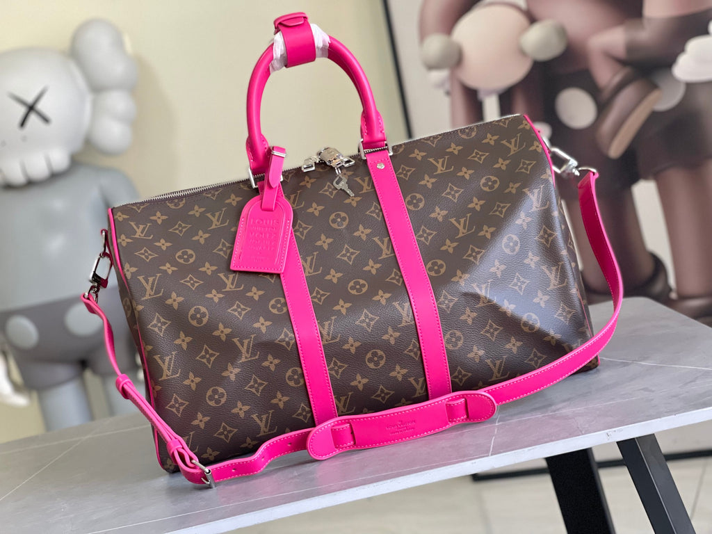 Keepall Bandoulière 50 – Monogram Canvas with Pink Leather Trim