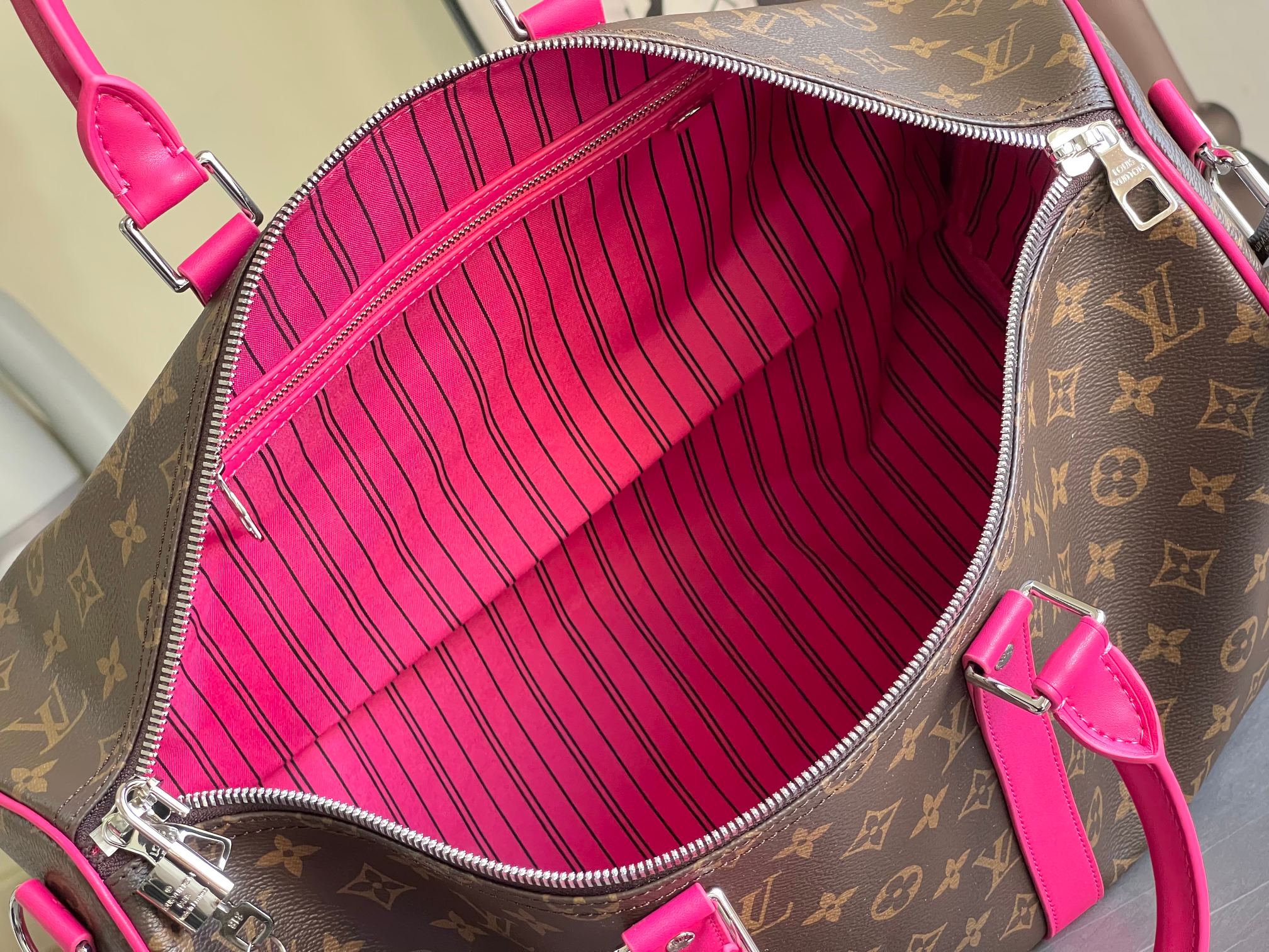 Keepall Bandoulière 50 – Monogram Canvas with Pink Leather Trim