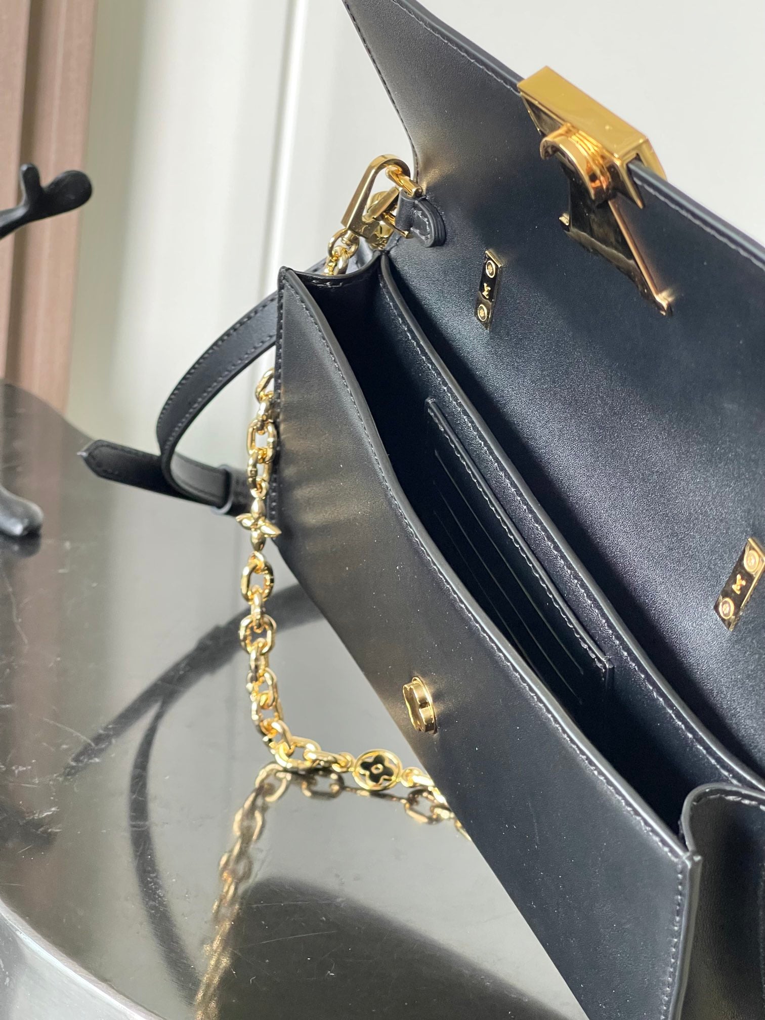 Capucines Wallet On Chain in Black Leather with Gold Chain