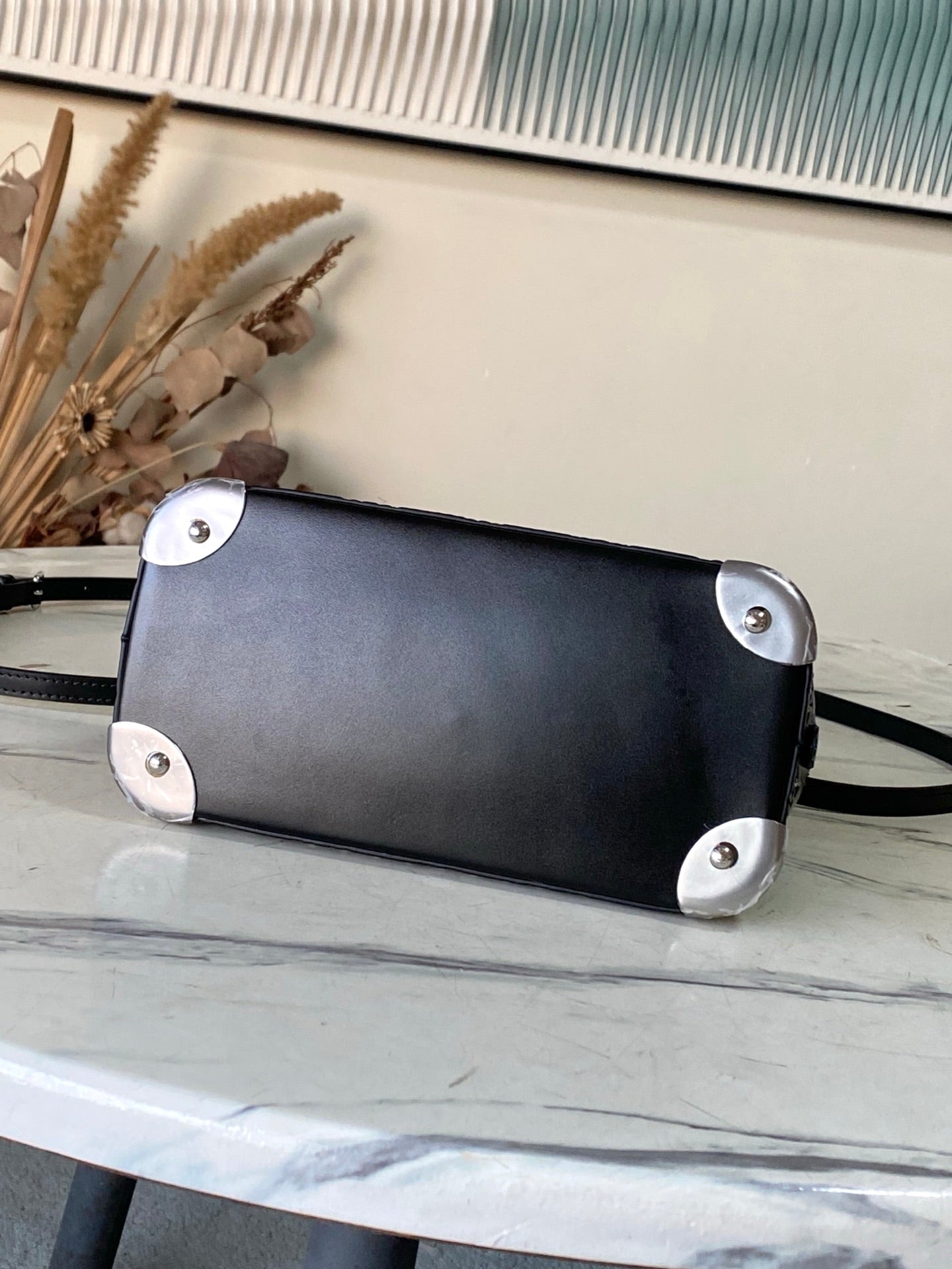 Alma BB Monogram Embossed Leather Handbag