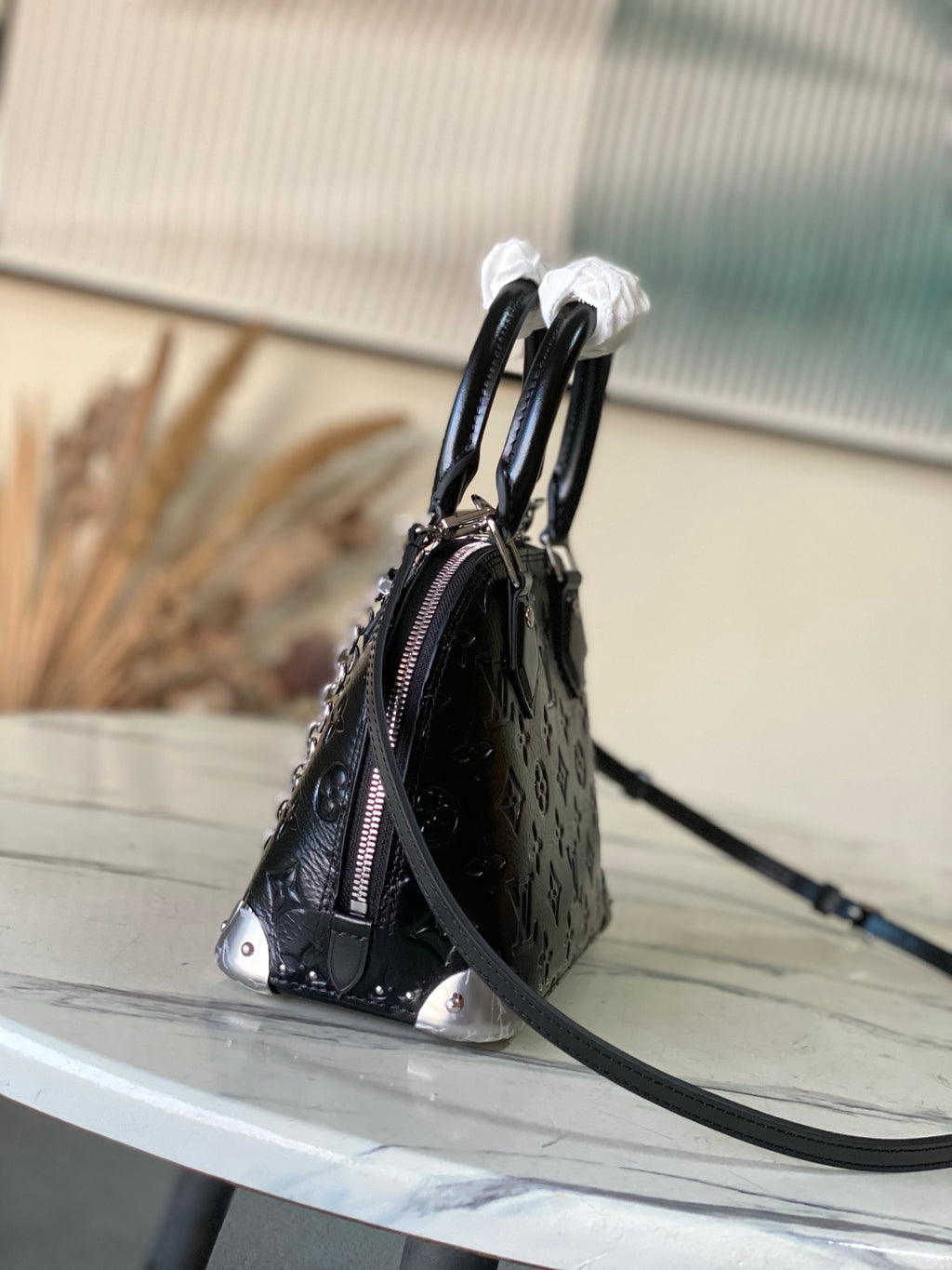 Alma BB Monogram Embossed Leather Handbag