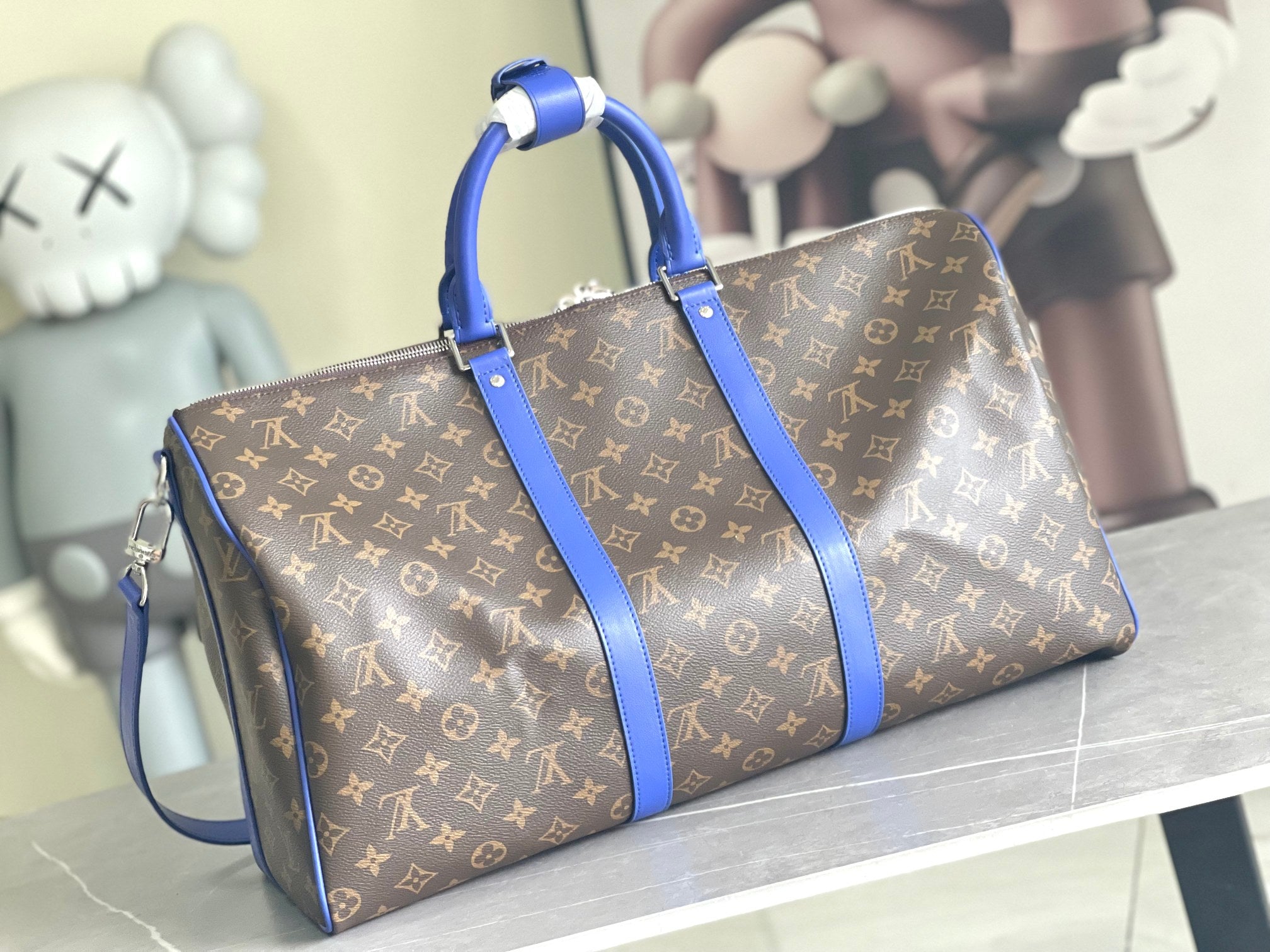 Keepall Bandoulière 50 – Monogram Canvas with Blue Leather Trim