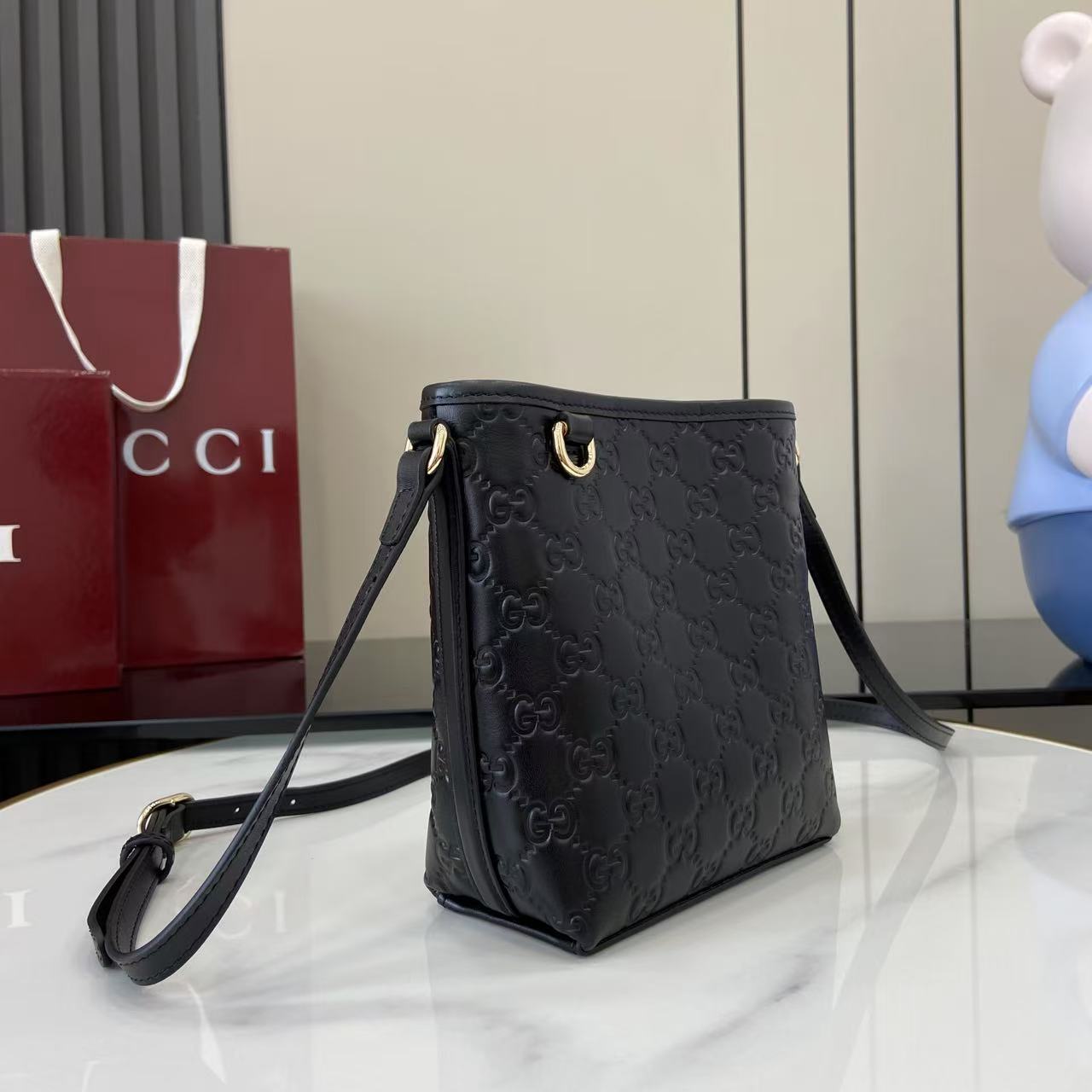 GG Emblem Mini Black Leather Crossbody Bag