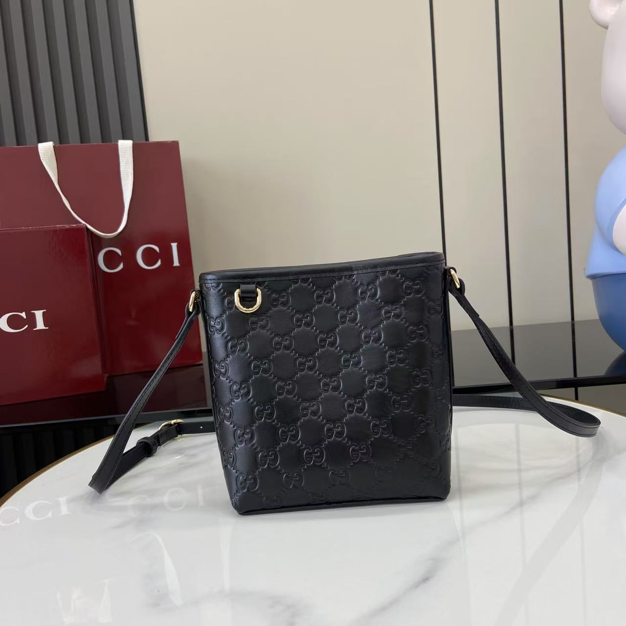 GG Emblem Mini Black Leather Crossbody Bag
