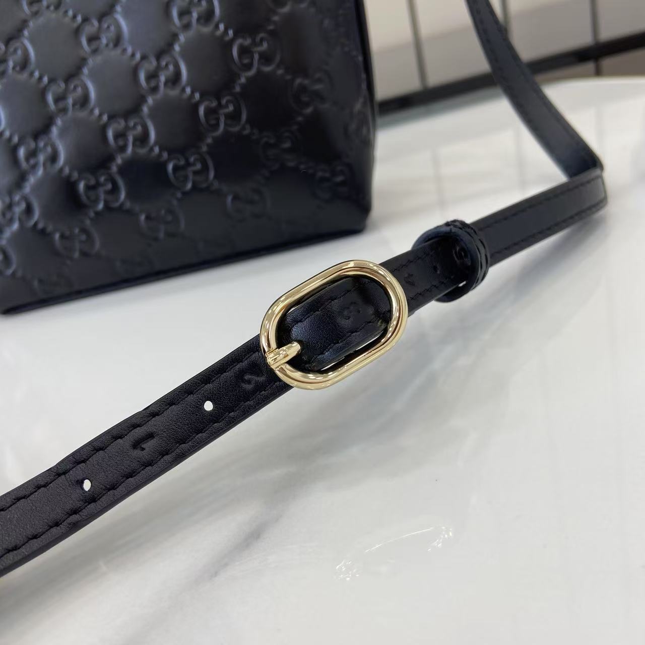 GG Emblem Mini Black Leather Crossbody Bag