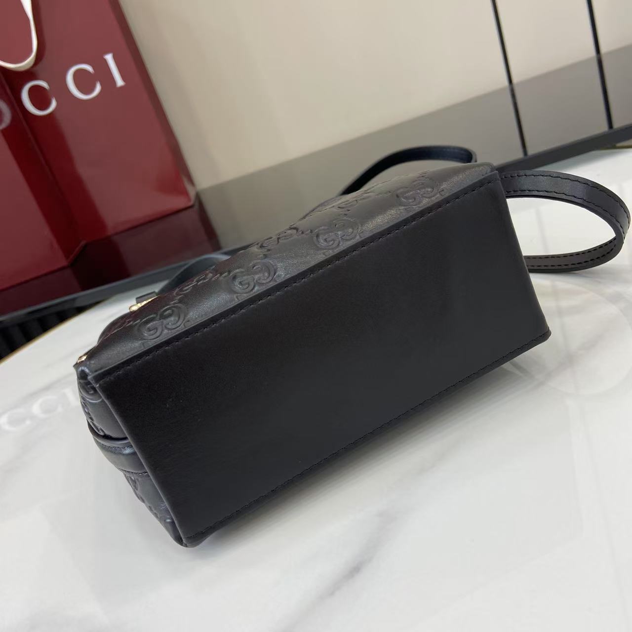 GG Emblem Mini Black Leather Crossbody Bag